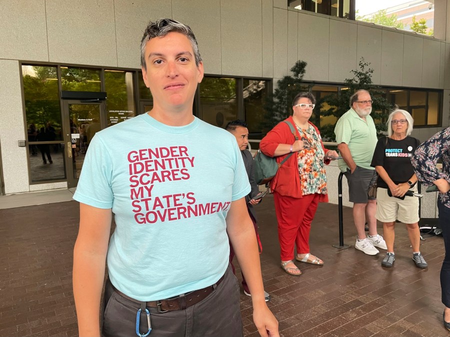 D Sellars, a nonbinary parent from Fuquay-Varina, N.C., stands outside the Legislative Office Building in Raleigh, N.C., Tuesday, June 20, 2023. Sellars was among dozens of LGBTQ+ people who showed up to speak in committee against a bill restricting gender-affirming care access but was not given time to testify. (AP Photo/Hannah Schoenbaum)