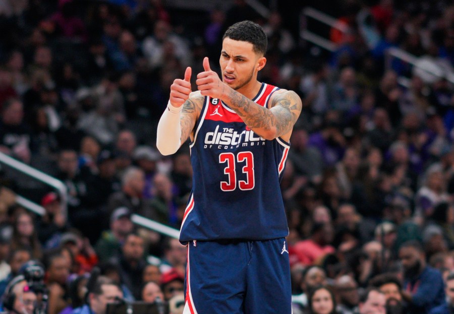 FILE - Washington Wizards forward Kyle Kuzma gestures to teammates during the second half of an NBA basketball game against the Sacramento Kings on March 18, 2023, in Washington. Kuzma will be a free agent when the league's annual offseason shopping period starts next week. Kuzma has declined his $13 million player option with the Wizards for next season, a person with knowledge of his decision said Tuesday, June 20, 2023, meaning he will be a free agent. The person spoke to The Associated Press on condition of anonymity because neither side disclosed the move. (AP Photo/Jess Rapfogel, File)