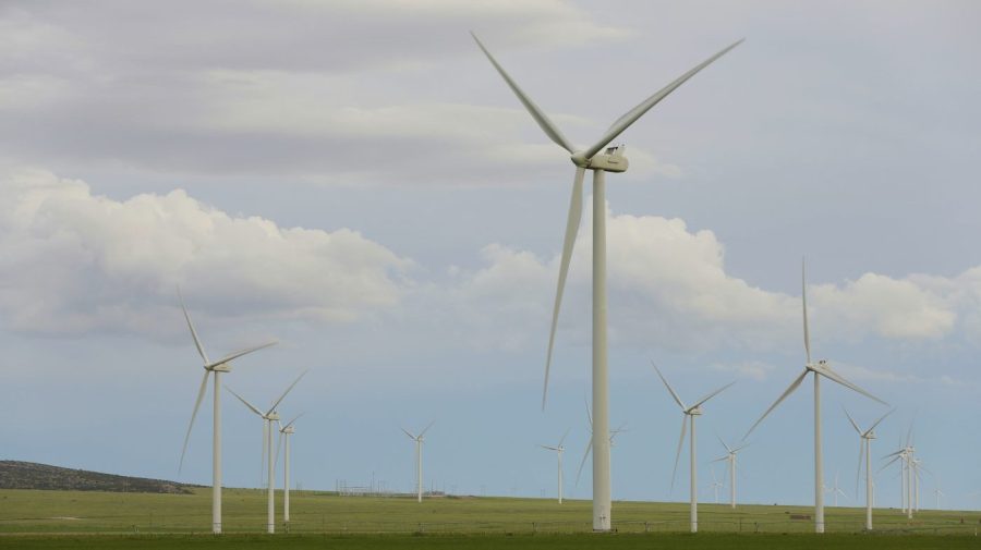 FILE - Wind turbines stand at a wind farm along the Montana-Wyoming state line on June 13, 2022. Wyoming and federal officials will formally kick off construction Tuesday, June 20, 2023, of a massive transmission line project to export wind power from Wyoming to southern California. But despite extensive wildlife studies, design tweaks and clearing of lengthy federal environmental reviews, the projects are now being built amid a more tepid attitude about wind power in Wyoming than when they were first proposed more than 15 years ago. (AP Photo/Emma H. Tobin, File)