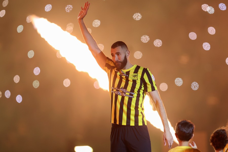 Saudi soccer team Al Ittihad player Karim Benzema greets Saudi fans during his presentation ceremony at King Abdullah Sports City Stadium in Jeddah, Saudi Arabia, Thursday, June 8, 2023. Benzema, who left Real Madrid after 14 years and 648 games, is set to play against his former Madrid teammate Cristiano Ronaldo, who joined Al-Nassr in January. (AP Photo)