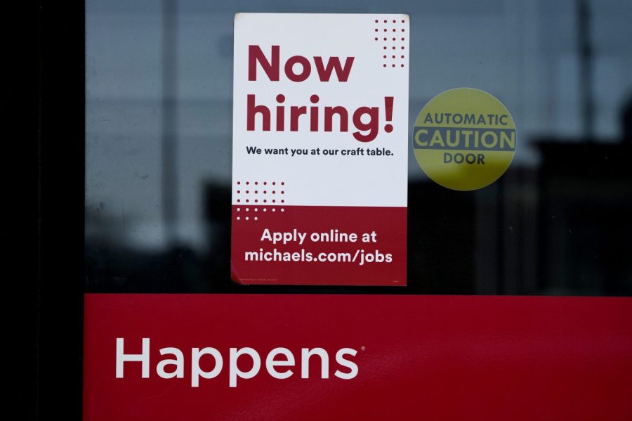 A hiring sign is displayed at a retail store in Downers Grove, Ill., Wednesday, April 12, 2023. On Thursday, the Labor Department reports on the number of people who applied for unemployment benefits last week.(AP Photo/Nam Y. Huh)