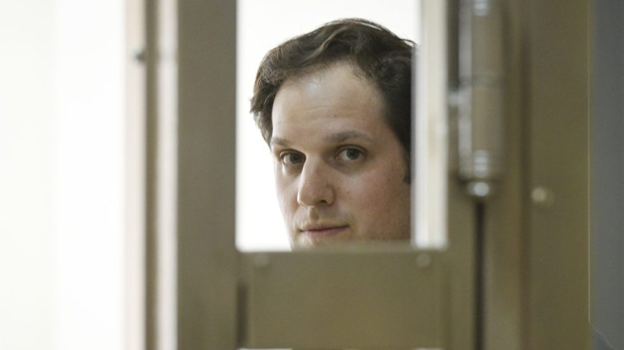 Wall Street Journal reporter Evan Gershkovich stands in a glass cage in a courtroom at the Moscow City Court in Moscow, Russia, Thursday, June 22, 2023. Gershkovich, a Wall Street Journal reporter detained on espionage charges in Russia, appeared in court Thursday to appeal his extended detention. (AP Photo/Dmitry Serebryakov)