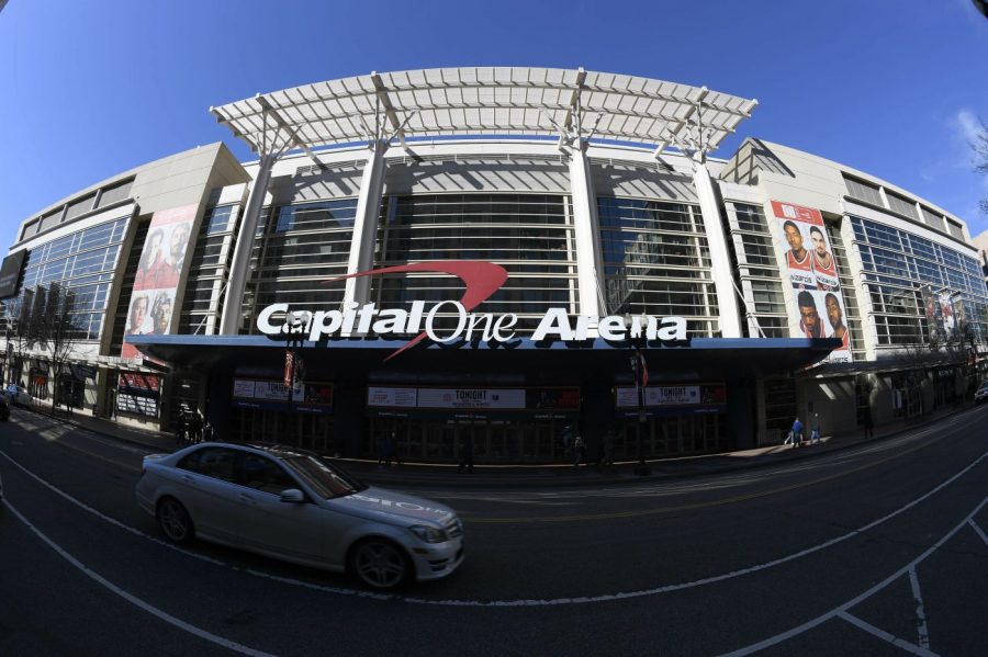 FILE - An exterior view of Capital One Arena is seen Saturday, March 16, 2019, in Washington. Capital One Arena is home to the Washington Capitals NHL hockey team and Washington Wizards NBA basketball team. A person with knowledge of the sale tells The Associated Press the Qatar Investment Authority is buying a 5% stake of the parent company of the NBA's Washington Wizards and NHL's Washington Capitals for $4.05 billion. It is believed to be the first time the government of Qatar is investing in North American professional sports. (AP Photo/Nick Wass)