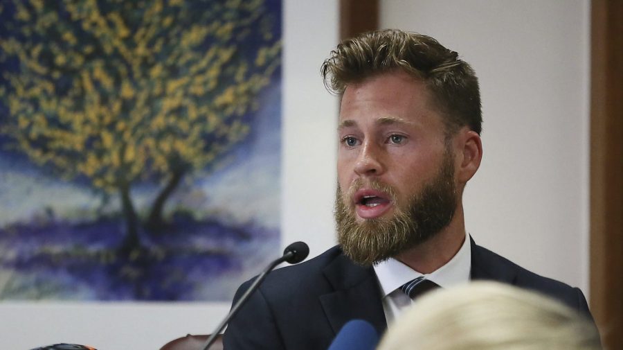 FILE - Owen Shroyer, an InfoWars host and sometimes reporter who is a frequent guest on the Alex Jones Show, testifies during Jones' defamation damages trial at the Travis County Courthouse, July 29, 2022, in Austin, Texas. Infowars host Owen Shroyer, who promoted baseless claims of 2020 election fraud on the far-right internet platform, pleaded guilty on Friday, June 23, 2023, to joining the mob of Donald Trump supporters who rioted at the U.S. Capitol. (Briana Sanchez/Austin American-Statesman via AP, Pool, File)