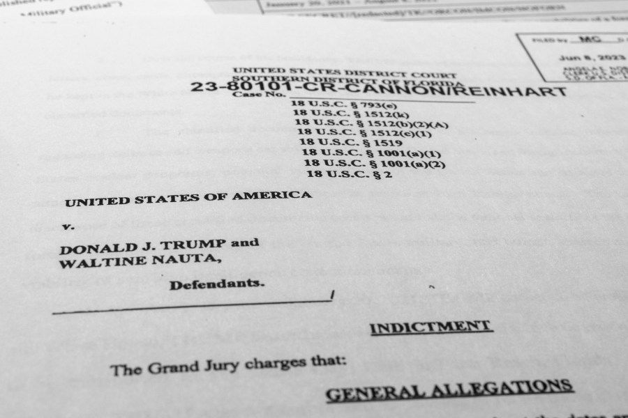 FILE - The indictment against former President Donald Trump and Walt Nauta is photographed on June 9, 2023. Nauta, a valet for Trump is set to be arraigned June 27 on charges that he helped the former president hide classified documents that the Justice Department wanted back. Nauta was charged earlier this month alongside Trump in a 38-count indictment filed by Justice Department special counsel Jack Smith.(AP Photo/Jon Elswick, File)