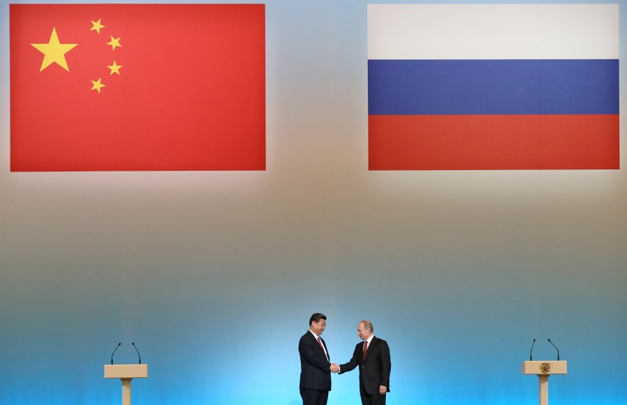 FILE - Russian President Vladimir Putin, right, and Chinese President Xi Jinping shake hands at the opening ceremony of the Year of Chinese tourism in Russia, in the Kremlin in Moscow, Friday, March 22, 2013. China's muted reaction to the Wagner mercenary group uprising against Russia's military belies Beijing's growing anxieties over the war in Ukraine and how this affects the global balance of power. (AP Photo/Sergei Ilnitsky, Pool, File)