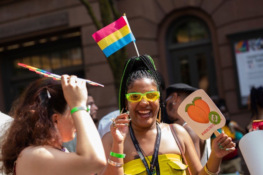 FILE - People attend a Queer Juneteenth Block Party, sponsored by The Center, Sunday, June 18, 2023, in New York. From a block party in New York City to a movie screening outside of Denver, groups across the U.S. have found ways to merge Pride month and Juneteenth celebrations. (AP Photo/Jeenah Moon, File)