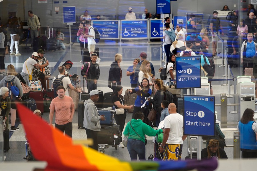 Travelers line up at the departure area check-in at the United Airlines terminal at Los Angeles International airport, Wednesday June 28, 2023, in Los Angeles. Travelers waited out widespread delays at U.S. airports on Tuesday, an ominous sign heading into the long July 4 holiday weekend, which is shaping up as the biggest test yet for airlines that are struggling to keep up with surging numbers of passengers. (AP Photo/Damian Dovarganes)