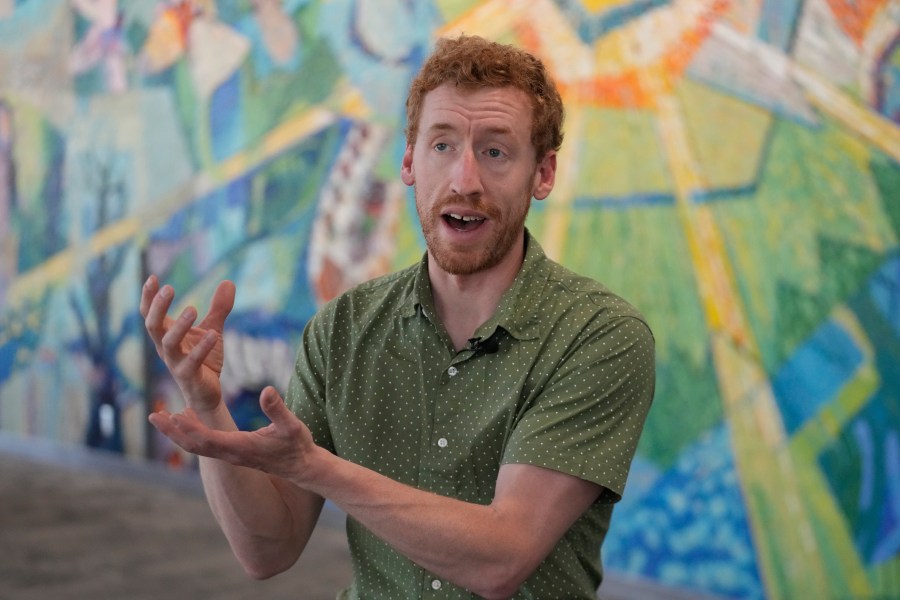 Scott Hotaling, a Utah State University ecologist who studies biodiversity in cold and high altitude environments, speaks during an interview on Wednesday, June 28, 2023, in Logan, Utah. Patches of pinkish snow in parts of the Utah mountains that some call "watermelon snow" is attracting curious photo-seekers this summer. Hotaling said it is actually a green algae that turns red to protect itself from ultraviolet radiation. (AP Photo/Rick Bowmer)