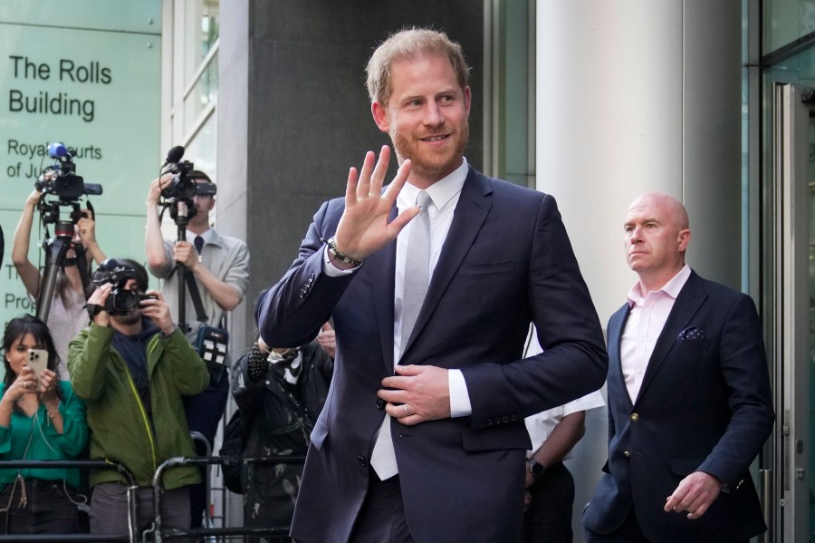 FILE - Prince Harry leaves the High Court after giving evidence in London, Wednesday, June 7, 2023. Prince Harry is seeking 320,000 pounds ($406,000) in his phone hacking lawsuit against Mirror Group Newspapers. The Duke of Sussex's lawyer submitted the claim in a court document Friday, June 30, 2023, at the conclusion of the trial that began in early May. (AP Photo/Kin Cheung, File)