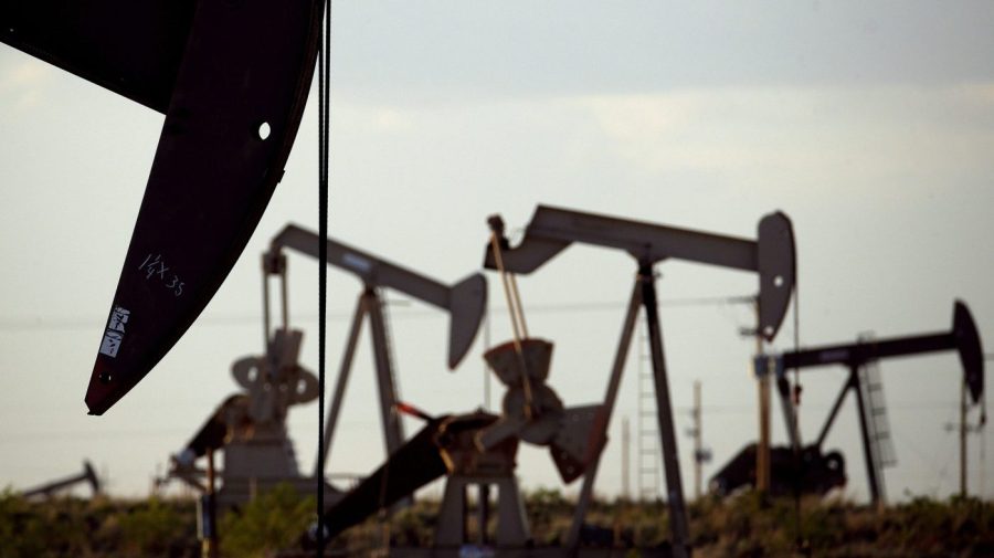 FILE - Pump jacks work in a field near Lovington, N.M., April 24, 2015. New Mexico oilfield and air quality regulators on Thursday, June 29, 2023, announced unprecedented state fines against a Texas-based oil and natural gas producer on accusations that the company flouted local pollution reporting and control requirements by burning off vast amounts of natural gas in a prolific energy-production zone in the southeast of the state. (AP Photo/Charlie Riedel, File)