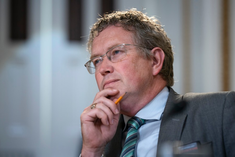 FILE - Rep. Thomas Massie, R-Ky., listens as the House Rules Committee prepares a bill at the Capitol in Washington, June 12, 2023. On Friday, June 30, Republican infighting erupted in Kentucky over gubernatorial nominee Daniel Cameron's plans to attend a rally sponsored by an ex-rival who is now looking to challenge an incumbent GOP congressman next year. Congressman Massie said it would be a mistake for Cameron to attend the September rally hosted by Eric Deters in northern Kentucky. (AP Photo/J. Scott Applewhite, File)