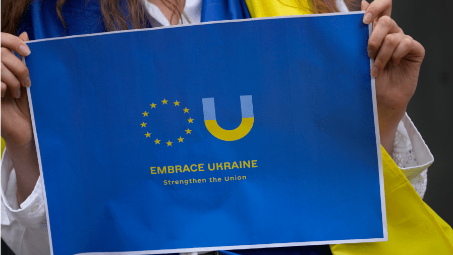 FILE - Members of the Ukrainian community in Portugal demonstrate outside of the Dutch embassy in Lisbon in support of Ukraine joining the European Union, on June 15, 2022. One year has nearly passed when the EU nations granted Ukraine membership status, but on Europe Day, when the 27 current members celebrate their unity, it shows how far that moment is still off. (AP Photo/Armando Franca, File)