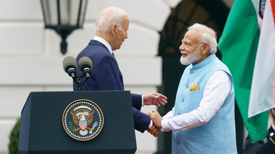 President Biden and Indian Prime Minister Narendra Modi shake hands