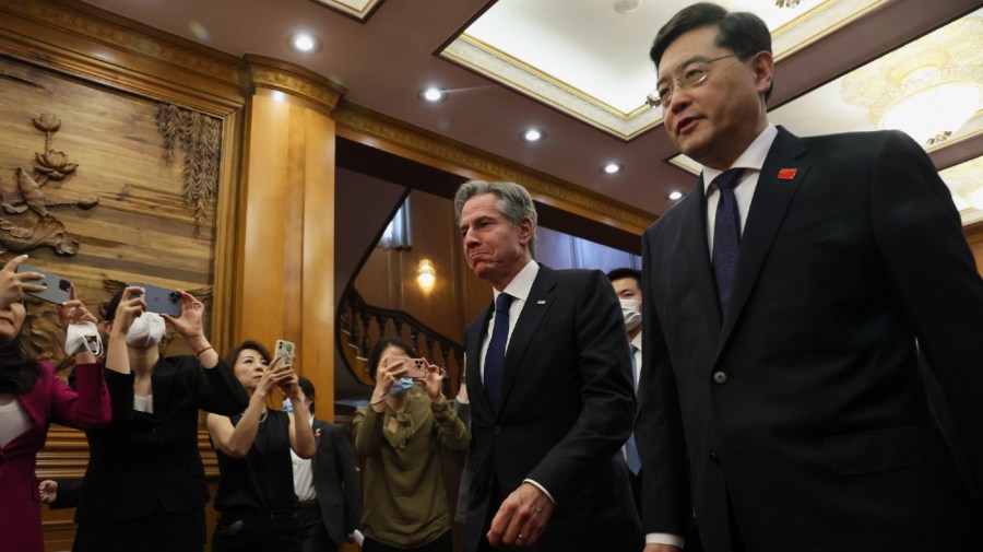 U.S. Secretary of State Antony Blinken, center, walks with Chinese Foreign Minister Qin Gang, right, at the Diaoyutai State Guesthouse in Beijing, China, Sunday, June 18, 2023.