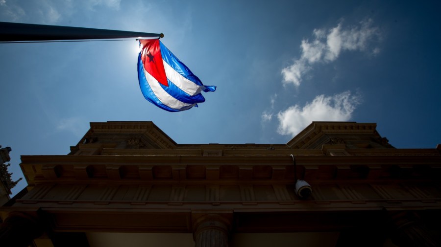 File - The Cuban flag over their new embassy in Washington, Monday, July 20, 2015.