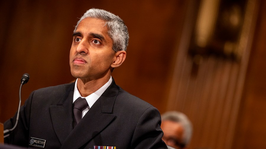 U.S. Surgeon General Vivek Murthy listens during a congressional hearing.