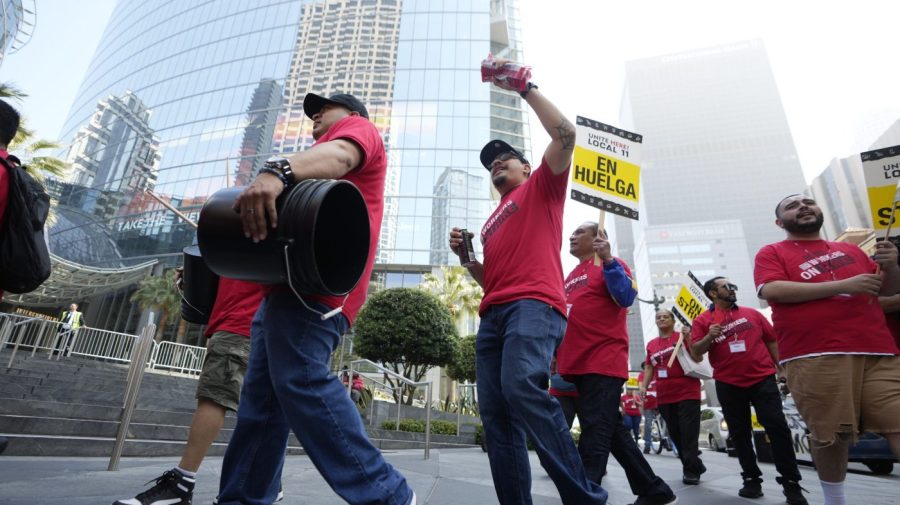 Striking hotel workers rally outside the Intercontinental Hotel after walking off their job early Sunday, July 2, 2023, in downtown Los Angeles. (AP Photo/Damian Dovarganes)