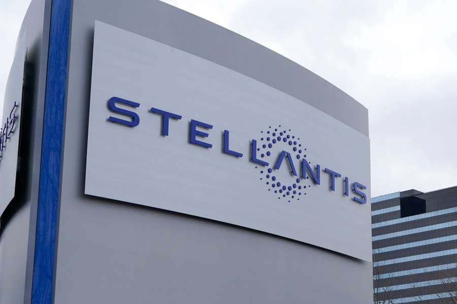 FILE - A Stellantis sign is seen outside the Chrysler Technology Center, Jan. 19, 2021, in Auburn Hills, Mich. Stellantis says that when it starts to sell compact and midsize electric vehicles off new underpinnings next year, they will be able to go up to 435 miles (700 kilometers) per charge. The company made the claim Wednesday, July 5, 2023, as it unveiled its new medium-sized platform designed for the purpose of housing battery packs and electric drive trains. (AP Photo/Carlos Osorio, File)