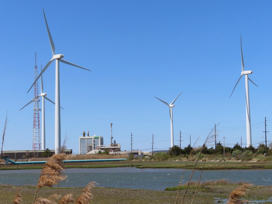 Land-based windmills turn in the wind in Atlantic City, N.J., on April 28, 2022. On July 3, 2023, Atlantic Shores, the approved developer of New Jersey's third offshore wind farm, said it, too, wants a tax break or other financial assistance, hinting that its project might not be able to be done without the kind of assistance New Jersey lawmakers granted the week before to a competitor, Orsted, which has approval to build two of the state's three approved offshore wind farms. (AP Photo/Wayne Parry)