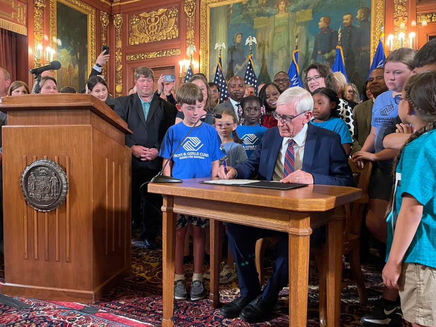 Democratic Wisconsin Gov. Tony Evers signed a two-year spending plan into law, Wednesday, July 5, 2023, in Madison, Wis. The budget was authored by Republicans who control the Legislature, but Evers used his partial veto powers to revise portions of it. (AP Photo/Harm Venhuizen)