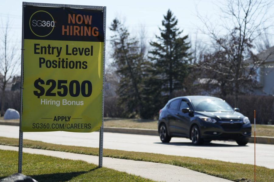 File - A hiring sign is shown in Wheeling, Ill., Sunday, March 19, 2023. On Thursday, the Labor Department reports on the number of people who applied for unemployment benefits last week. (AP Photo/Nam Y. Huh, File)