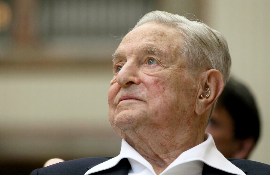 FILE - George Soros, founder and chairman of the Open Society Foundations, attends the Joseph A. Schumpeter award ceremony in Vienna, Austria, June 21, 2019. Several human rights organizations are concerned about Open Society Foundations plans to lay off 40% of their global staff — the nonprofit's second major cut in three years — as billionaire investor Soros hands over leadership to his son. (AP Photo/Ronald Zak, File)