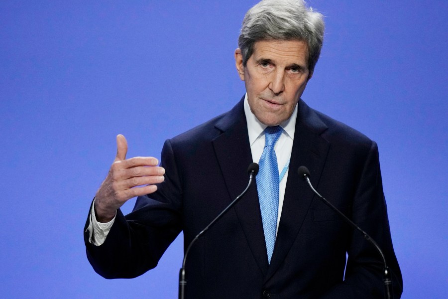 FILE - John Kerry, United States Special Presidential Envoy for Climate, speaks after a news conference given by China's Special Envoy for Climate Change Xie Zhenhua at the COP26 U.N. Climate Summit in Glasgow, Scotland, on Nov. 10, 2021. Kerry will travel to Beijing next week to discuss strategies for limiting global warming, amid a push by the world’s two largest economies to reengage on multiple issues following a sharp decline in contacts. he will arrive Sunday, July 16, 2023. (AP Photo/Alastair Grant, File)