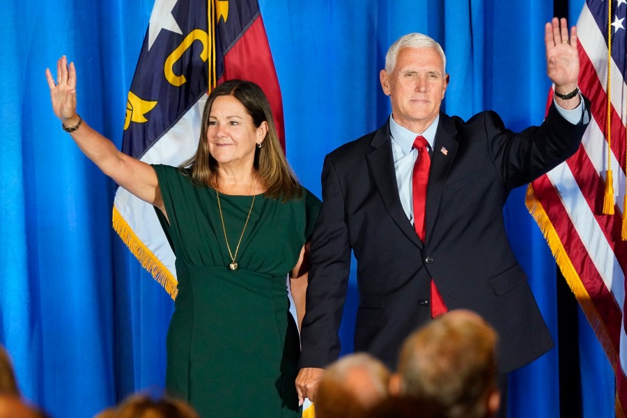 FILE - Republican presidential candidate former Vice President Mike Pence waves on stage with his wife Karen after he spoke during the North Carolina Republican Party Convention in Greensboro, N.C., June 10, 2023. Pence is leaning in on his anti-abortion stance as he campaigns for the Republican presidential nomination. Pence says he does not support exceptions in the case of nonviable pregnancies, when doctors have determined there is no chance a baby will survive outside the womb.(AP Photo/Chuck Burton, File)