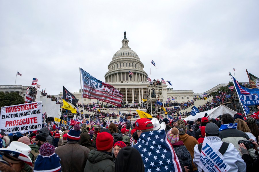 FILE - Rioters loyal to President Donald Trump rally at the U.S. Capitol in Washington on Jan. 6, 2021. Federal prosecutors say Taylor Taranto, 37, who prosecutors say participated in the Jan. 6, 2021 riot at the U.S. Capitol and arrested last week near the home of former President Barack Obama, told followers on his YouTube live stream that he was looking to get a “good angle on a shot” and that he was trying to locate the “tunnels underneath their houses” shortly before he was taken into custody by the Secret Service. (AP Photo/Jose Luis Magana, File)