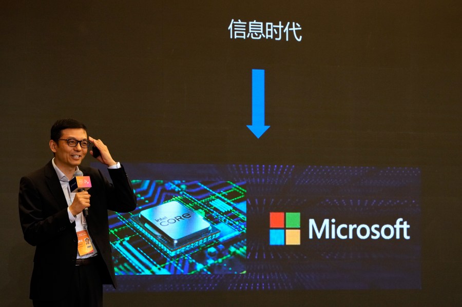 A presenter talks about Microsoft in the Information Age during the World Artificial Intelligence Conference in Shanghai, Thursday, July 6, 2023. A China-based hacking group has breached email accounts linked to government agencies in Western Europe, Microsoft Corp. said in a blog post published Tuesday, July 11. (AP Photo/Ng Han Guan)