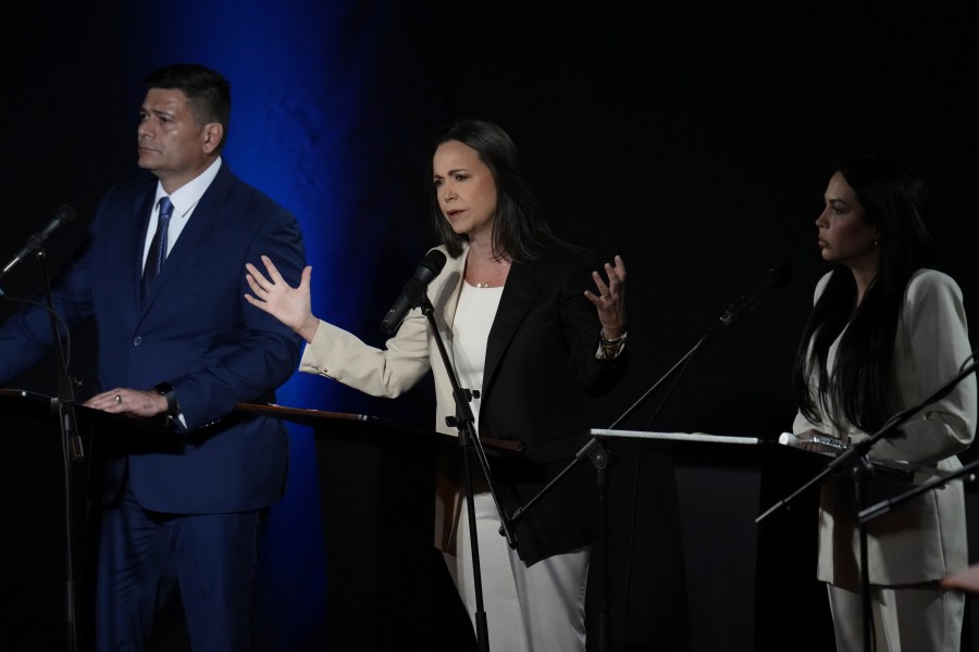 Maria Corina Machado speaks between Freddy Superlano, left, and Delsa Solorzano during a debate between opposition presidential hopefuls, at the Catholic University Andres Bello UCAB in Caracas, Venezuela, Wednesday, July 12, 2023. The opposition will hold primaries on Oct 22 to choose one candidate to face President Nicolas Maduro in 2024 elections. (AP Photo/Ariana Cubillos)