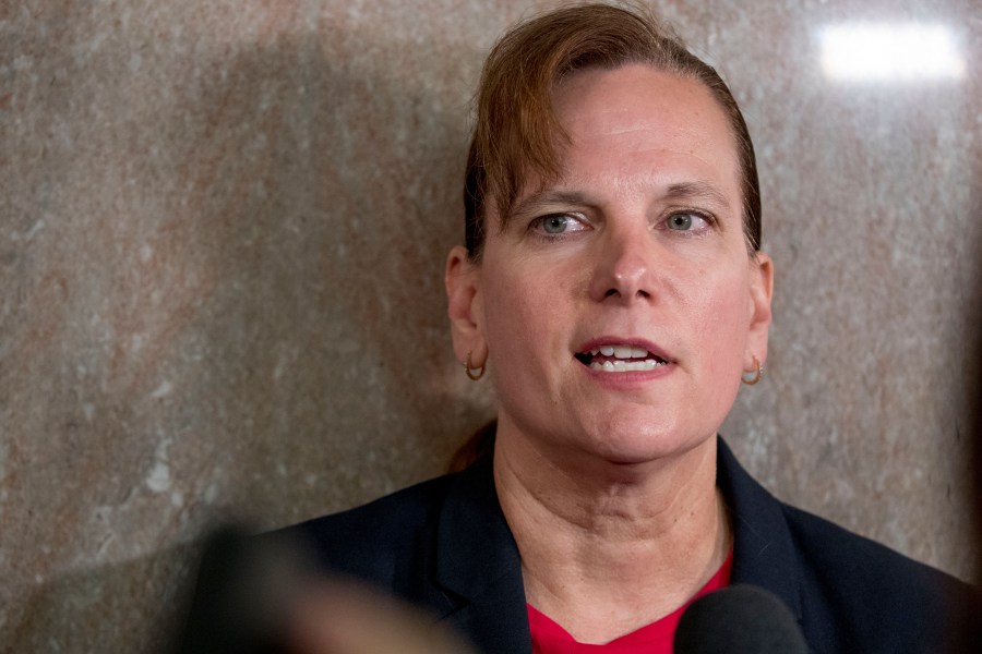 FILE - Army Col. Kathryn Spletstoser speaks to members of the media following Gen. John Hyten's confirmation hearing to be vice chairman of the Joint Chiefs of Staff before the Senate Armed Services Committee on Capitol Hill in Washington, July 30, 2019. Spletstoser, a retired Army colonel, has reached a court settlement of nearly $1 million in a sexual assault lawsuit against Hyten, who served as vice chairman of the Joint Chiefs of Staff. Spletstoser, who served as Hyten's aide in 2017, filed the lawsuit, and in the settlement reached in U.S. District Court in California on Wednesday, July 12, 2023, the federal government will pay her $975,000. (AP Photo/Andrew Harnik, File)