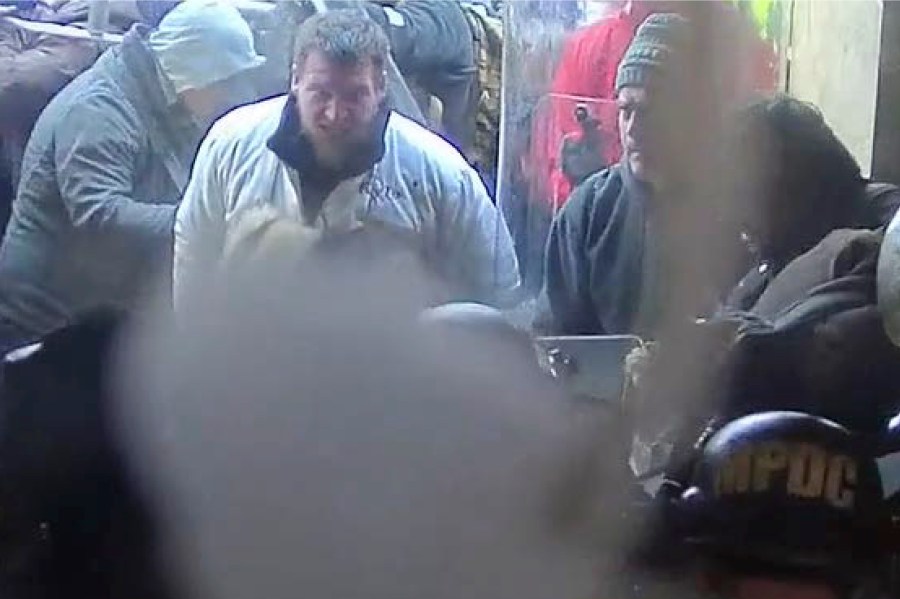 In this image from U.S. Capitol Police security video, released and annotated by the Justice Department in the Statement of Facts supporting an arrest warrant, Kyle Fitzsimons appears near a door to the U.S. Capitol on Jan. 6, 2021, in Washington. Fitzsimons was sentenced Thursday, July 13, 2023, to more than seven years in prison for hurling a bow like a spear at police and attacking several other officers on Jan. 6. (Justice Department via AP)