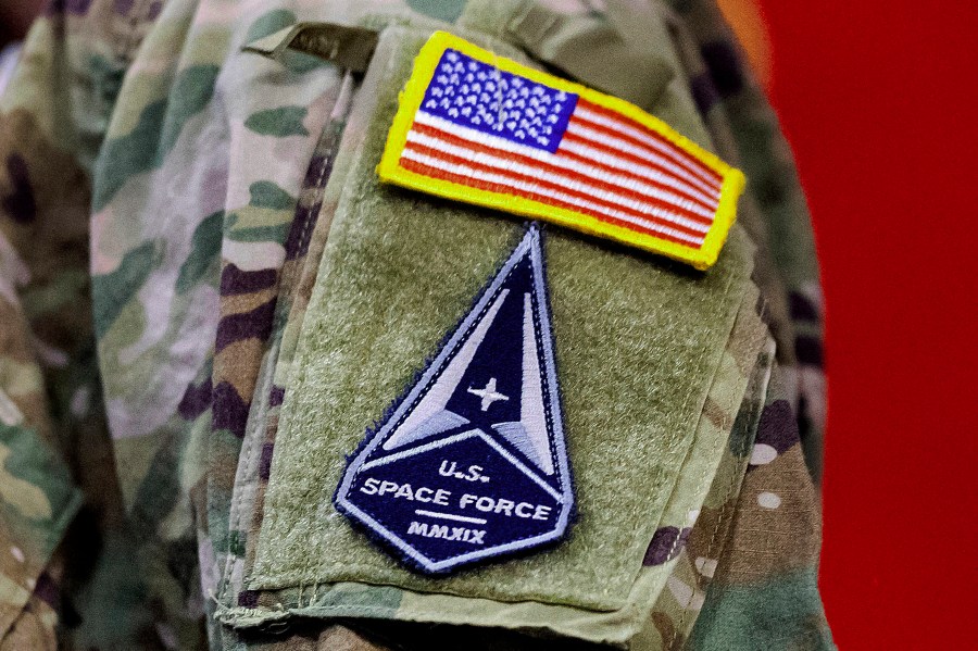 FILE - A solider wears a U.S. Space Force uniform during a ceremony for U.S. Air Force airmen transitioning to U.S. Space Force guardian designations at Travis Air Force Base, Calif., Feb. 12, 2021. Amid a freeze in military-to-military contacts, China is accusing the United States of militarizing outer space, a day after it protested the passage of a U.S. Navy P-8A Poseidon anti-submarine aircraft through the Taiwan Strait. (AP Photo/Noah Berger, File)