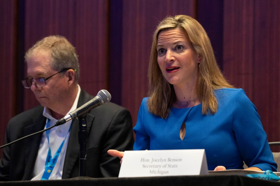 Jocelyn Benson, Michigan's Secretary of State, right, attends a panel about elections during the summer meeting of the National Association of Secretaries of State, Tuesday, July 11, 2023, in Washington. Efforts to deceive the public about voting and elections remain a top concern for state election officials as they dig into preparations for the 2024 election. (AP Photo/Jacquelyn Martin)