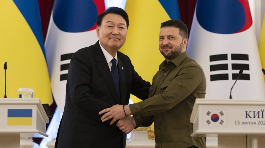 South Korean President Yoon Suk Yeol, left, and Ukrainian President Volodymyr Zelenskyy stand for photos after delivering statements, Saturday, July 15, 2023, in Kyiv, Ukraine. (AP Photo/Jae C. Hong)