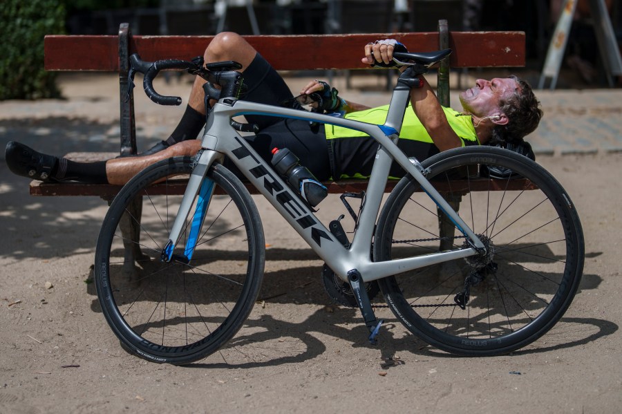 A man sunbathes at the Retiro park in Madrid, Spain, Monday, July 17, 2023. Spain’s Aemet weather agency said the heat wave this week “will affect a large part of the countries bordering the Mediterranean“ with temperatures in some southern areas of Spain exceeding 42 C (107 F). (AP Photo/Manu Fernandez)