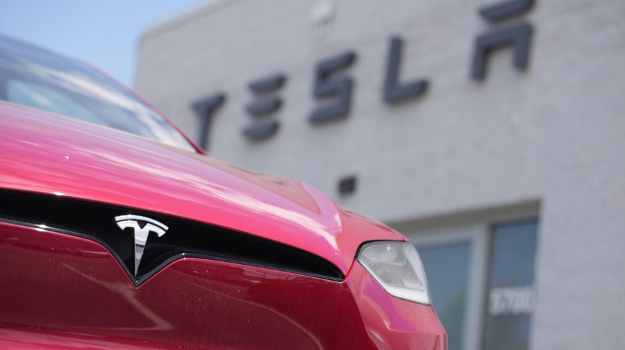 An unsold 2023 Model X sports-utility vehicle sits outside a Tesla dealership Sunday, June 18, 2023, in Littleton, Colo. Tesla earnings are reported on Wednesday. (AP Photo/David Zalubowski)