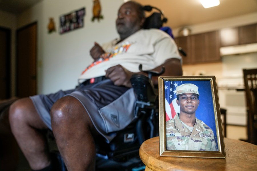 A portrait of American soldier Travis King is displayed as his grandfather, Carl Gates, talks about his grandson Wednesday, July 19, 2023, in Kenosha, Wis. Pvt. King bolted into North Korea while on a tour of the Demilitarized Zone on Tuesday, July 18, a day after he was supposed to travel to a base in the U.S. (AP Photo/Morry Gash)