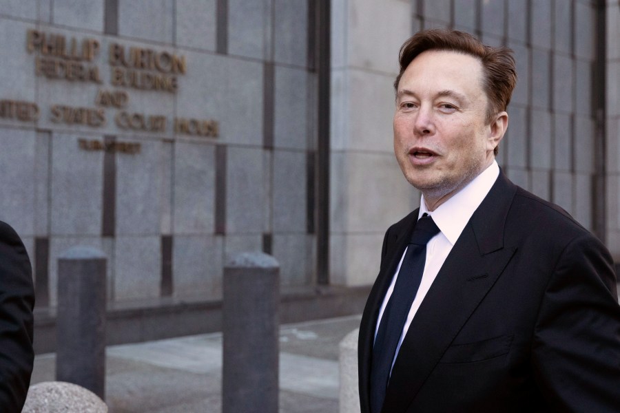 FILE - Elon Musk leaves the Phillip Burton Federal Building and United States Court House in San Francisco, Tuesday, Jan. 24, 2023. A federal appeals court Friday, July 21, said it will reconsider its March ruling that Musk unlawfully threatened employees with a loss of stock options in a 2018 Twitter post amid an organizing effort by the United Auto Workers union. (AP Photo/ Benjamin Fanjoy, File)