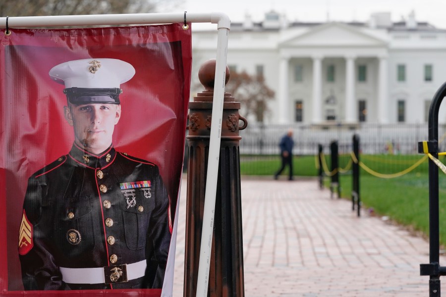 FILE - A poster photo of U.S. Marine Corps veteran and former Russian prisoner Trevor Reed stands in Lafayette Park near the White House, March 30, 2022, in Washington. Reed, a former U.S. Marine who was released from Russia in a prisoner swap last year, has been injured while fighting in Ukraine, the State Department and a person familiar with the matter said Tuesday. (AP Photo/Patrick Semansky, File)