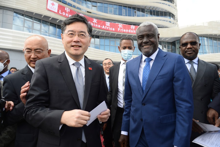 FILE - China's Foreign Minister, Qin Gang, left, and African Union Commission (AUC) chair Moussa Faki Mahamat, right, attend the inauguration of the Africa Centers for Disease Control and Prevention (Africa CDC) in Addis Ababa, Ethiopia, on Jan. 11, 2023. China has removed outspoken foreign minister Qin Gang from office and replaced him with his predecessor, Wang Yi. In an announcement on Tuesday, July 25, 2023, state media gave no reason for Qin’s removal, but it comes after he dropped out of sight almost one month ago amid speculation over his personal affairs and political rivalries.(AP Photo, File)