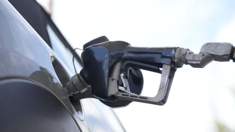 A motorist fills up a vehicle at a Shell gasoline station Sunday, June 18, 2023, in Englewood, Colo. The most-anticipated recession probably in modern U.S. history still hasn't arrived. Despite higher borrowing costs, thanks to the Federal Reserve's aggressive streak of interest rate hikes, consumers keep spending, and employers keep hiring. Gas prices are falling and grocery prices have leveled off, giving Americans more spending power. (AP Photo/David Zalubowski)