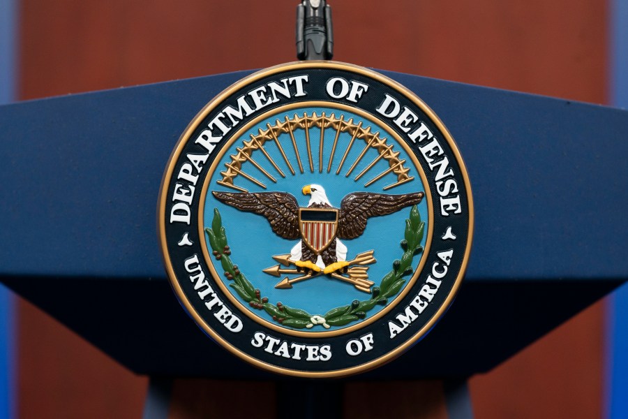 FILE - The seal of the Department of Defense is seen on the podium at the Pentagon, Sept. 27, 2022, in Washington. President Joe Biden will sign an executive order that gives decisions on the prosecution of serious military crimes, including sexual assault, to independent military attorneys, taking that power away from victims' commanders. (AP Photo/Alex Brandon, File)