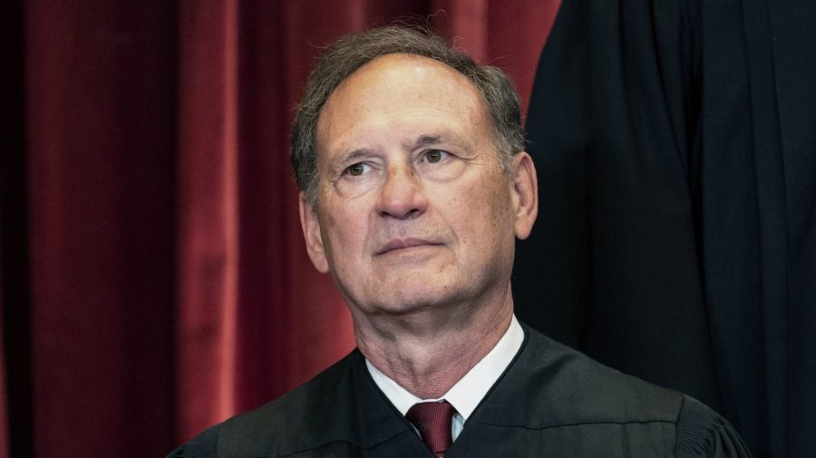 Justice Samuel Alito poses for a Supreme Court group photo.