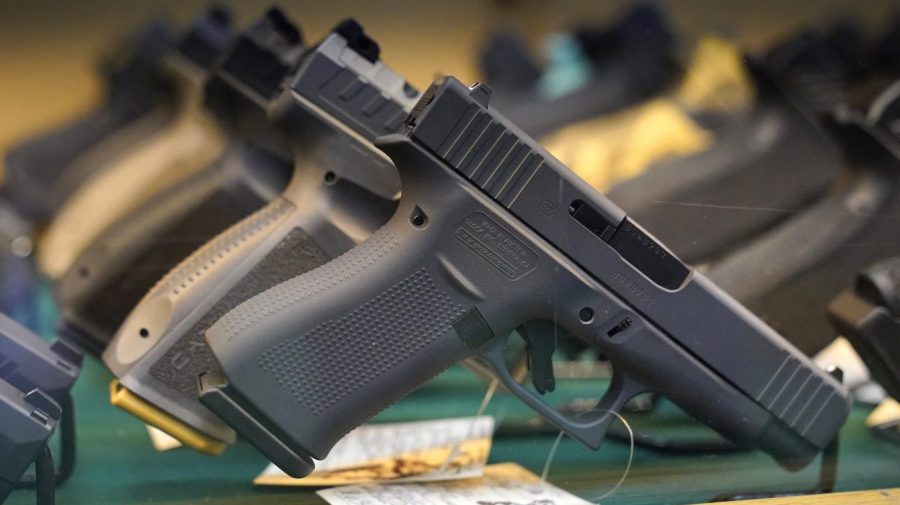 Handguns are displayed at a pawn shop on Monday, July 18, 2022.