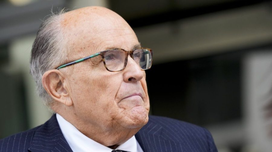 Rudy Giuliani speaks with reporters as he departs the federal courthouse, Friday, May 19, 2023, in Washington.