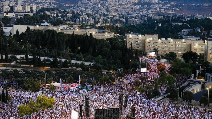 Israelis protest against Prime Minister Benjamin Netanyahu's judicial overhaul plan outside the parliament in Jerusalem, Sunday, July 23, 2023.