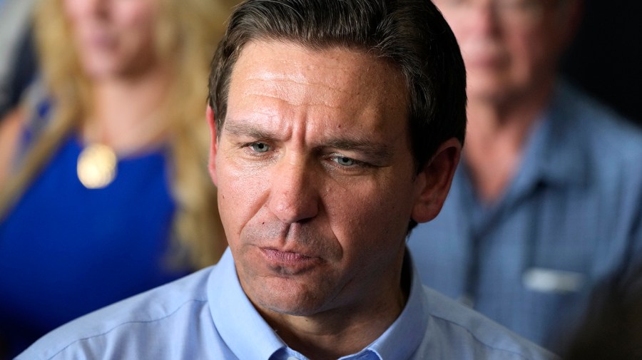 FILE - Republican presidential candidate Florida Gov. Ron DeSantis speaks to reporters at U.S. Rep. Zach Nunn's Annual BBQ, Saturday, July 15, 2023, in Ankeny, Iowa.